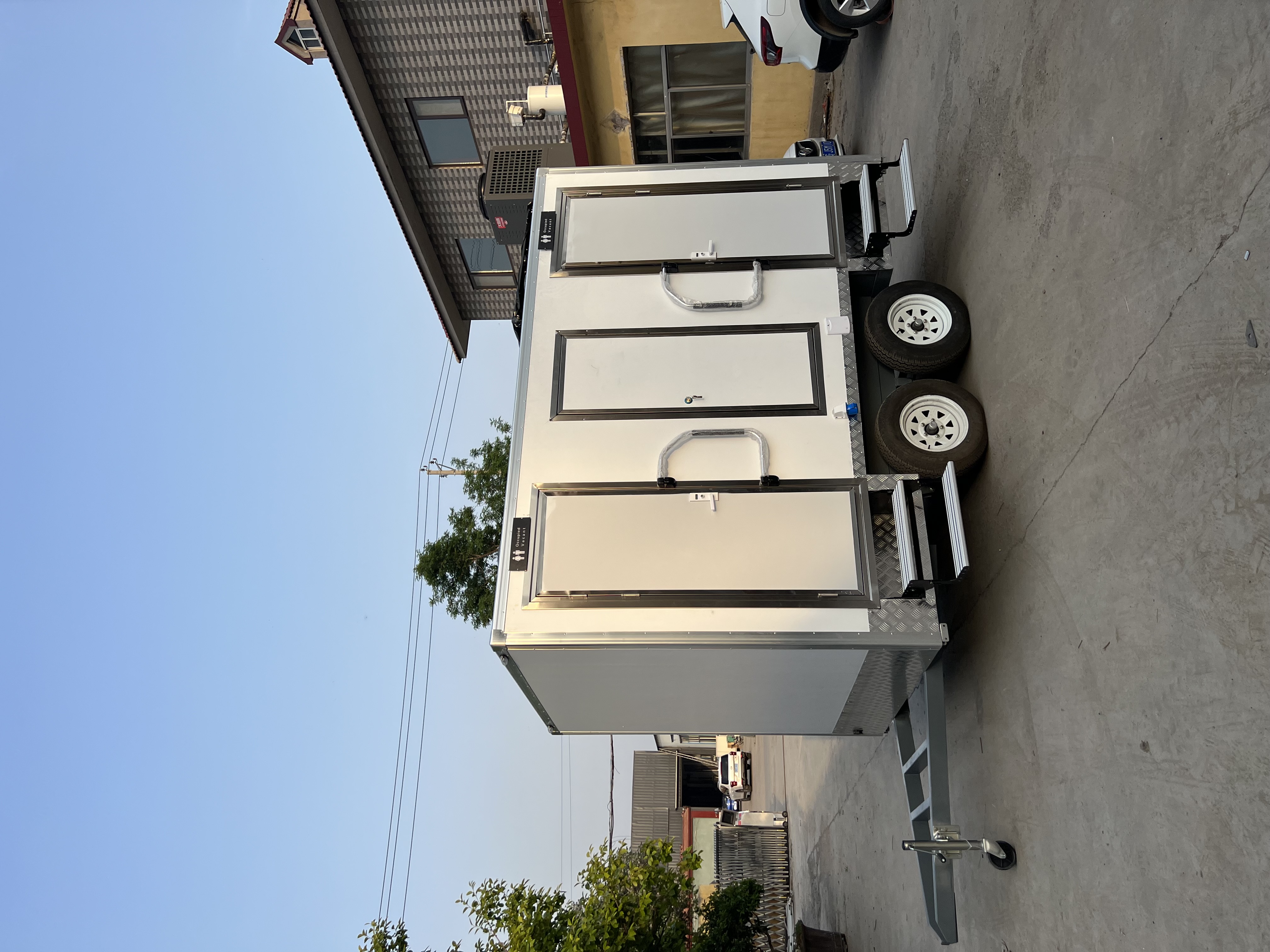 Two-wheel mobile multi-cabin toilet, outdoor emergency and convenient toilet