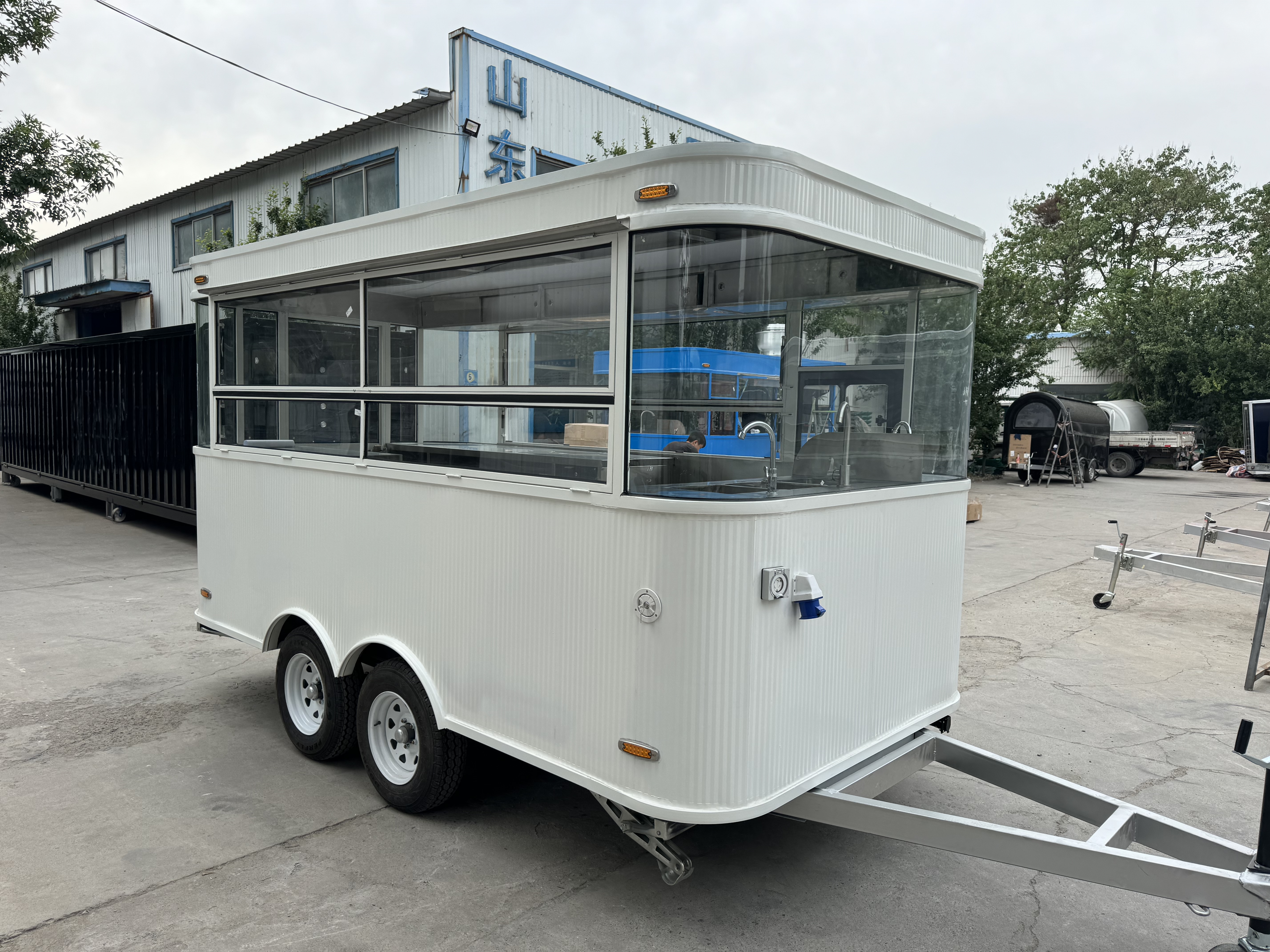 White fashionable mobile food truck, outdoor business food truck, convenient catering vehicle