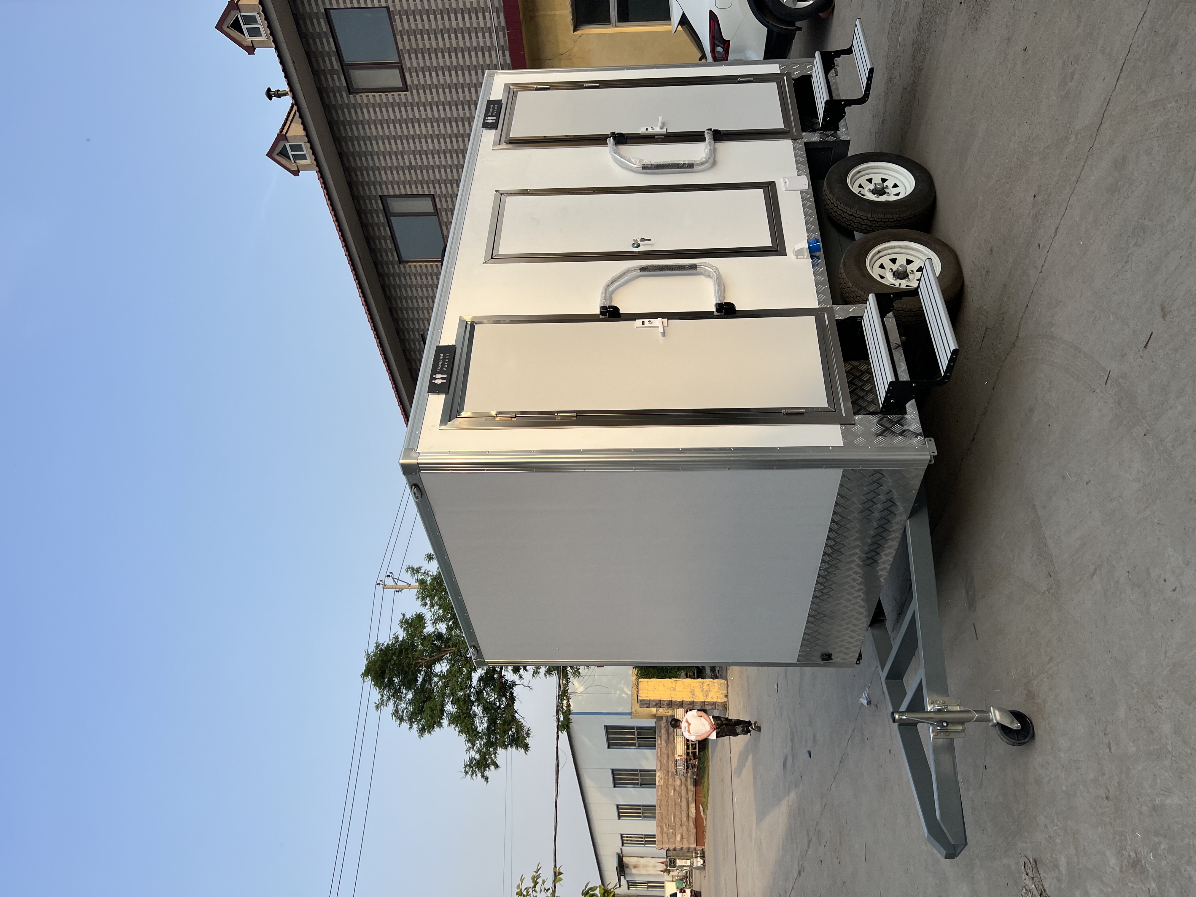 Two-wheel mobile multi-cabin toilet, outdoor emergency and convenient toilet