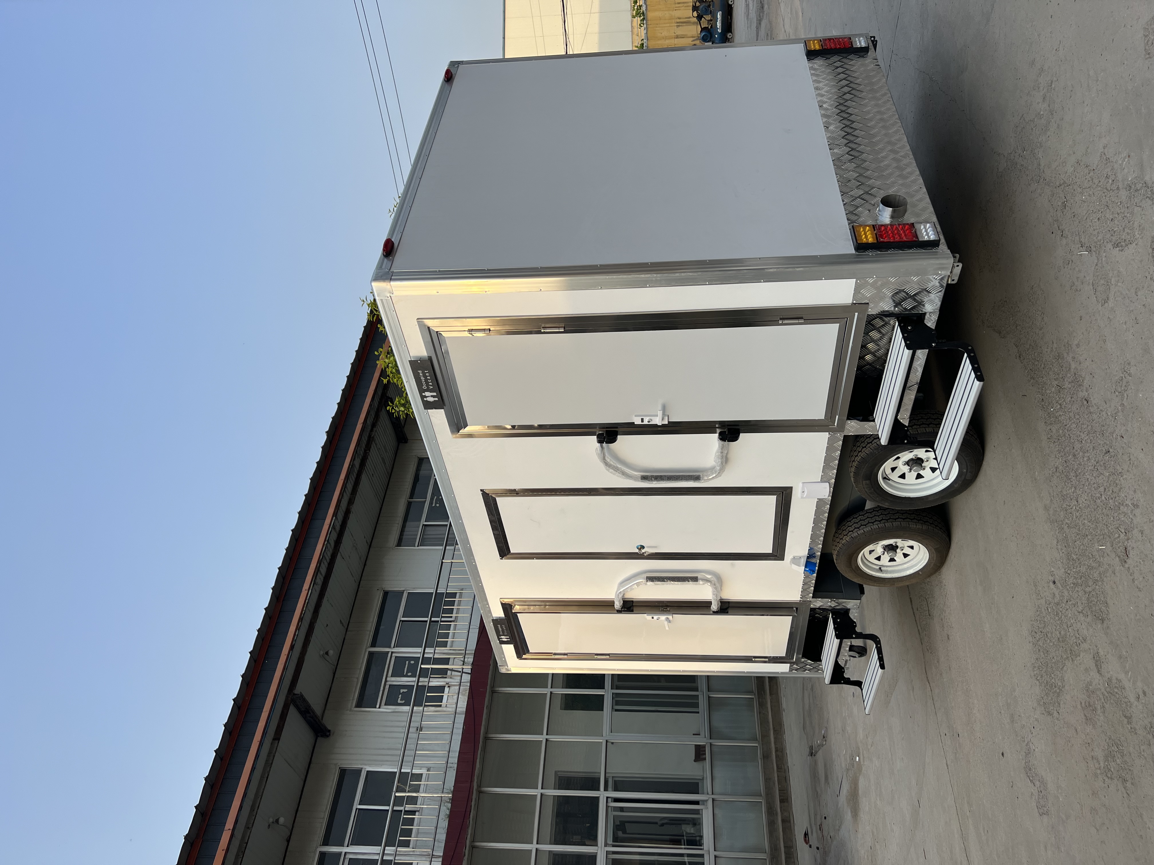 Two-wheel mobile multi-cabin toilet, outdoor emergency and convenient toilet