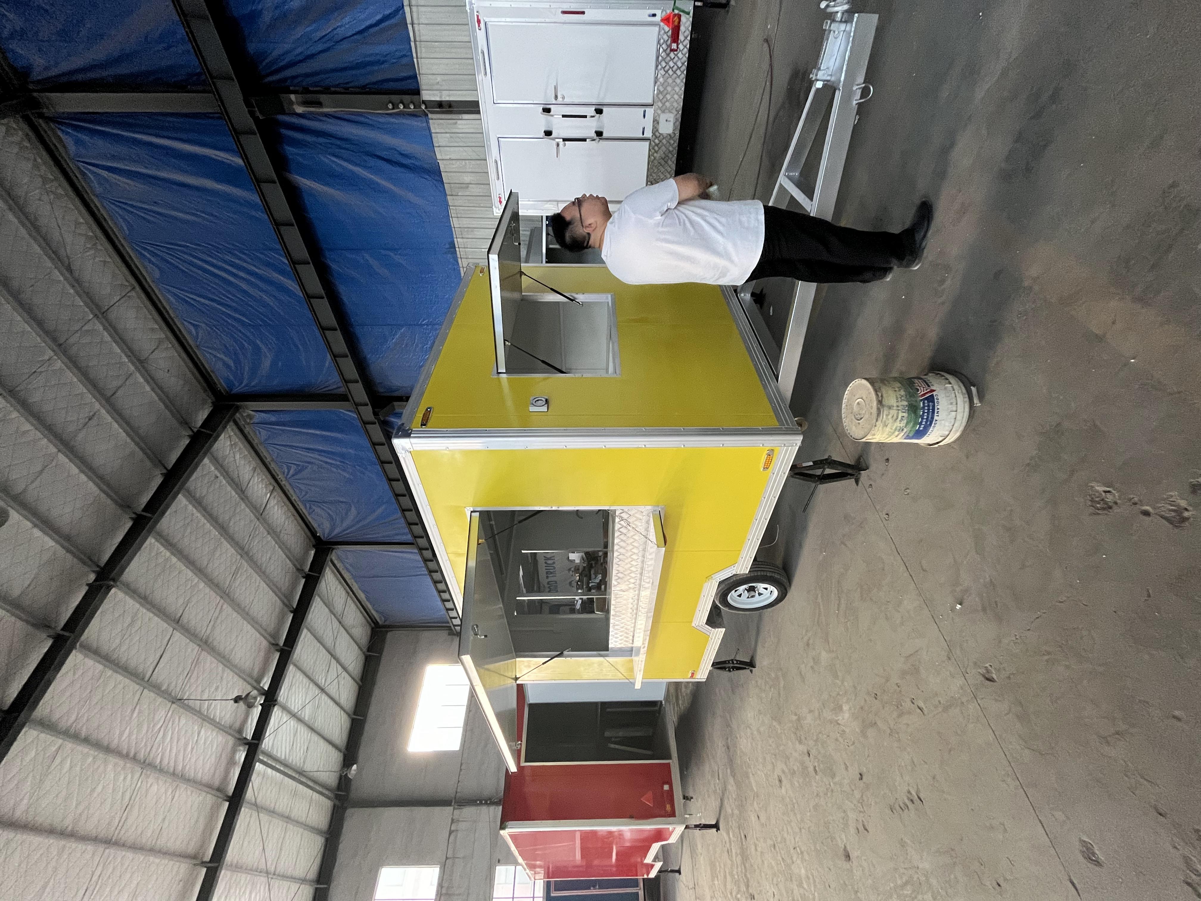 The bright yellow mobile food truck initiates a new flexible food business model