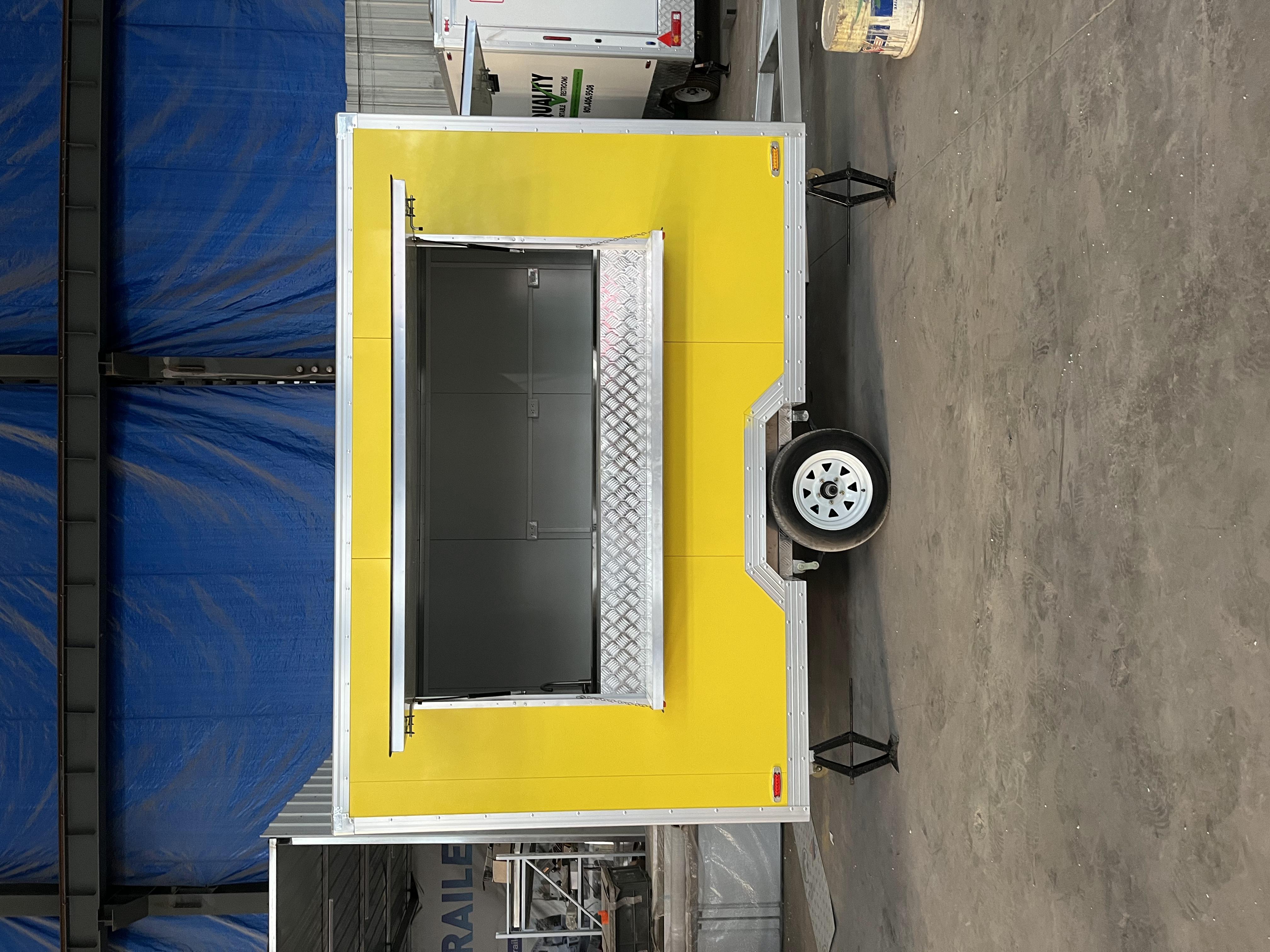 The bright yellow mobile food truck initiates a new flexible food business model