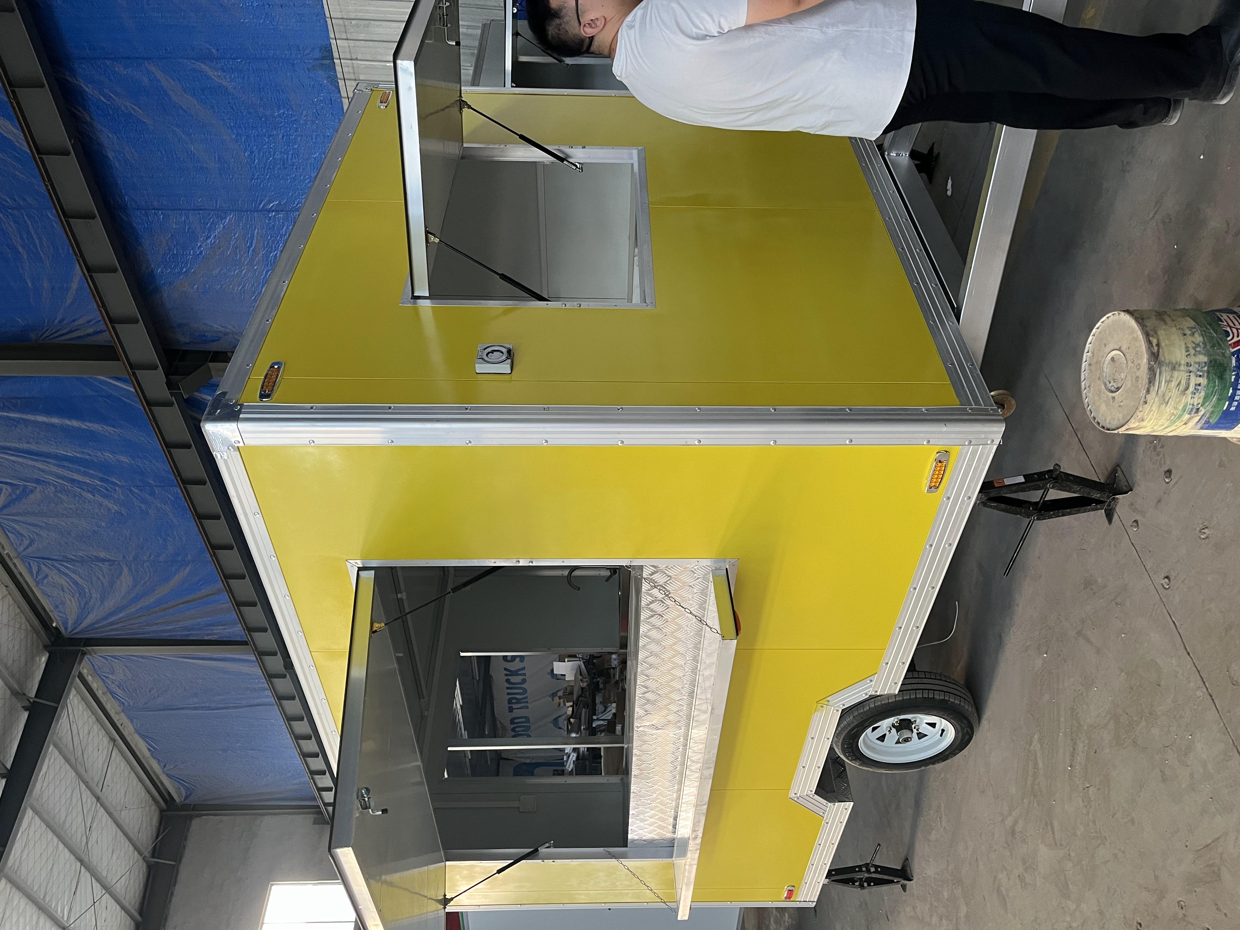 The bright yellow mobile food truck initiates a new flexible food business model