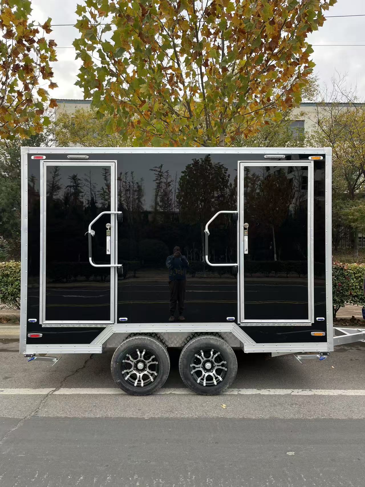 Black and gold marble-patterned outdoor portable toilet