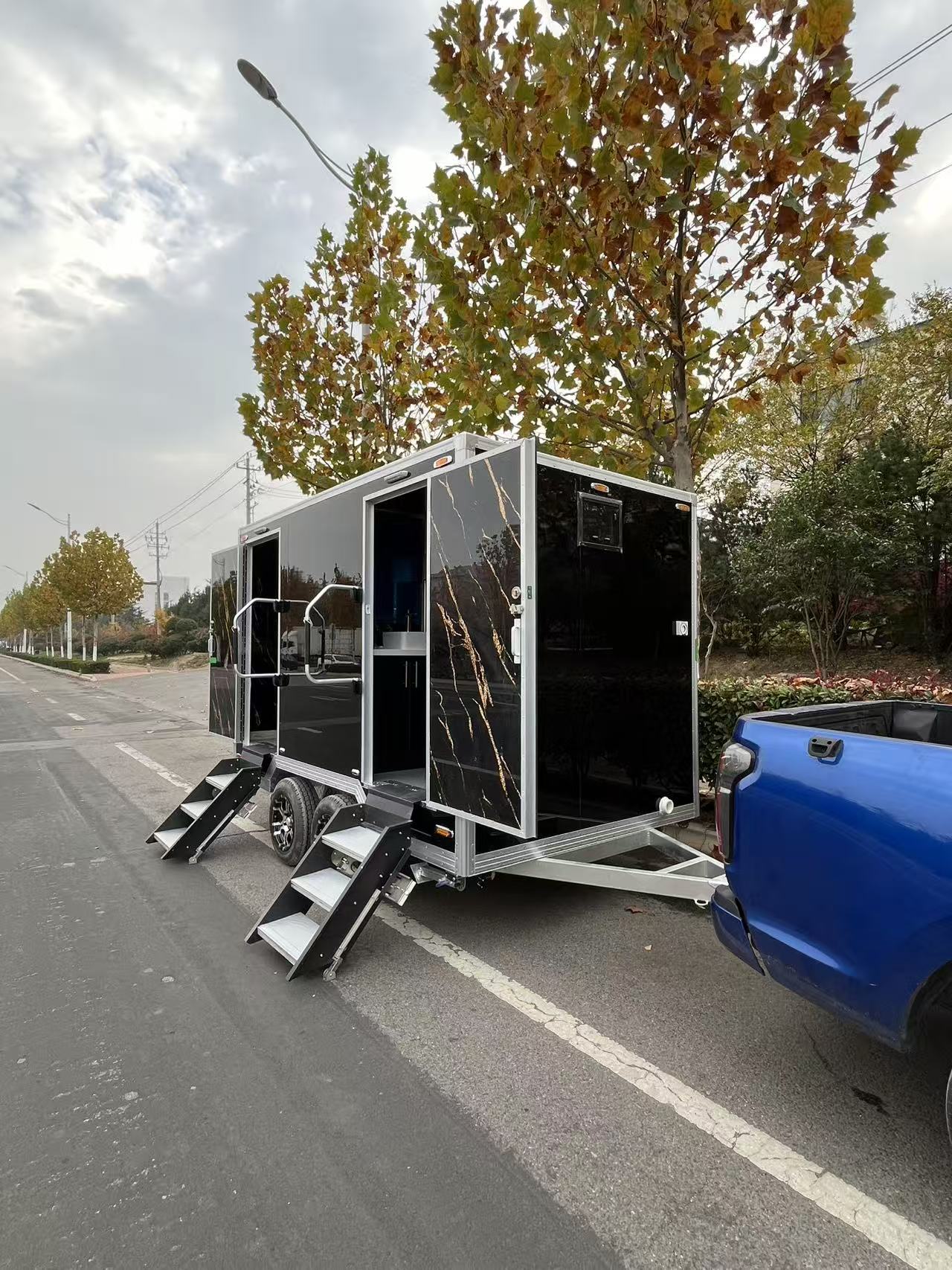 Black and gold marble-patterned outdoor portable toilet