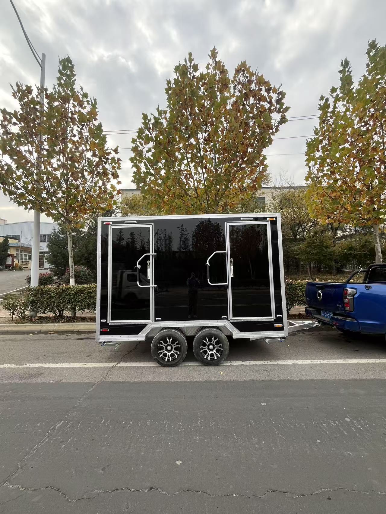 Black and gold marble-patterned outdoor portable toilet