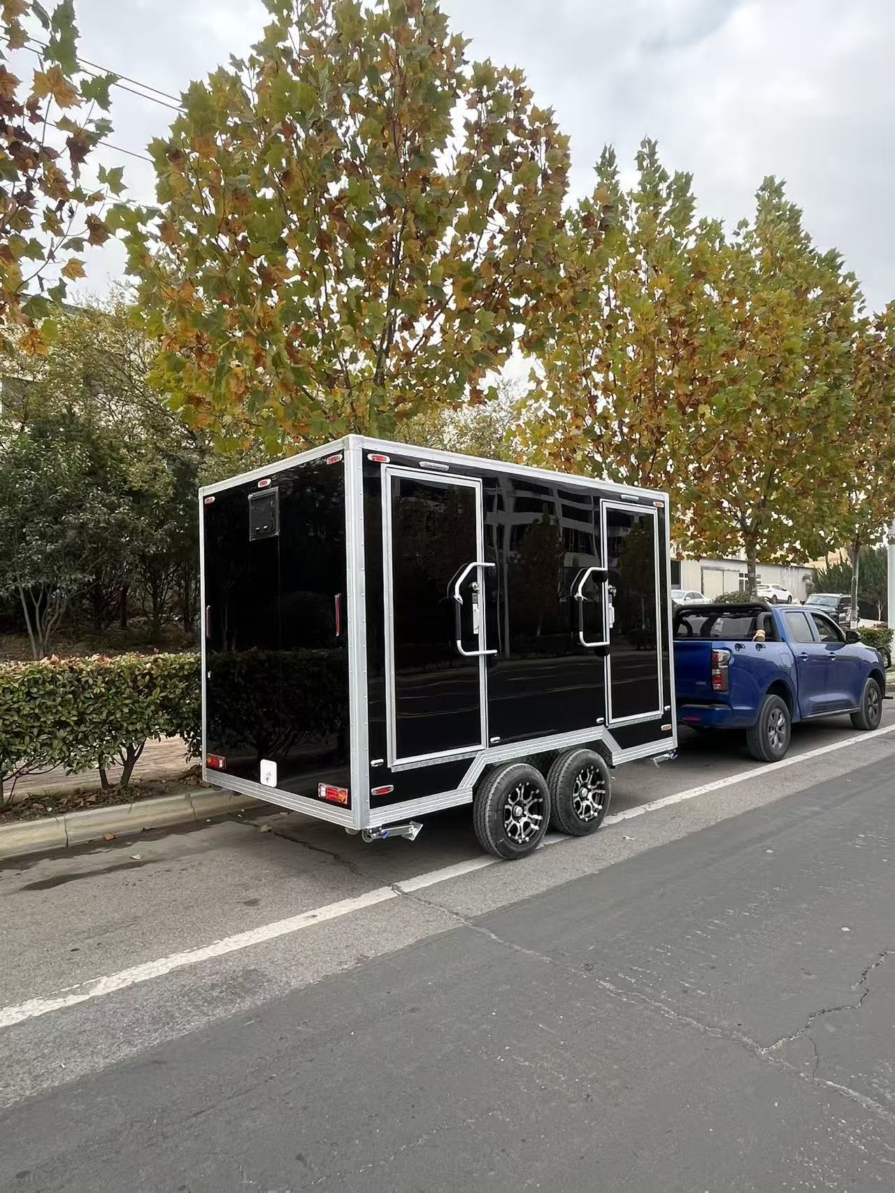 Black and gold marble-patterned outdoor portable toilet